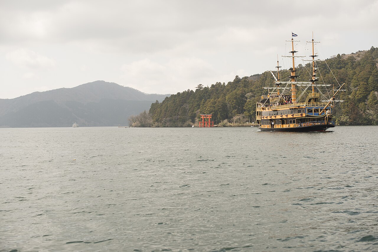 A Hakone pirate ship cruising on Lake Ashi with Mount Fuji in the background