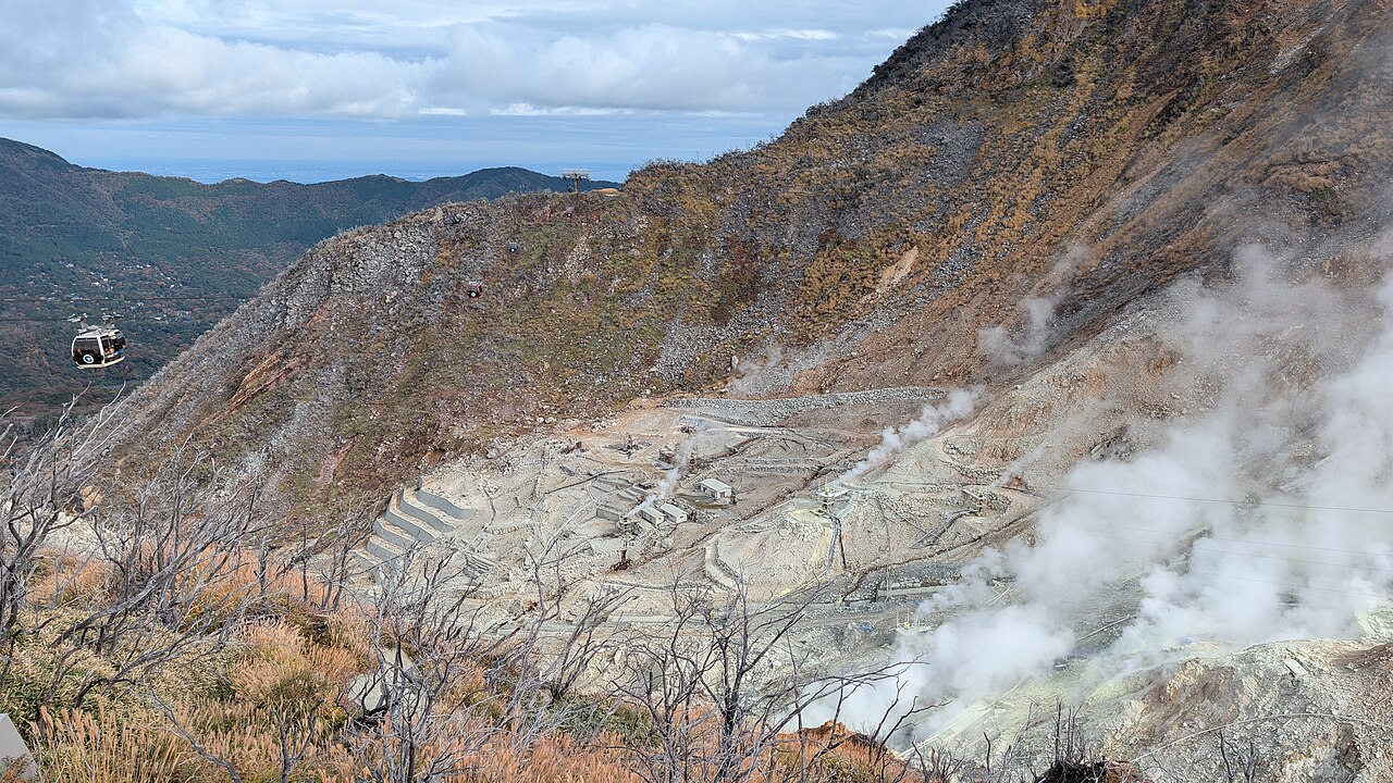 Dramatic landscape of Owakudani with steam rising from active sulfur vents