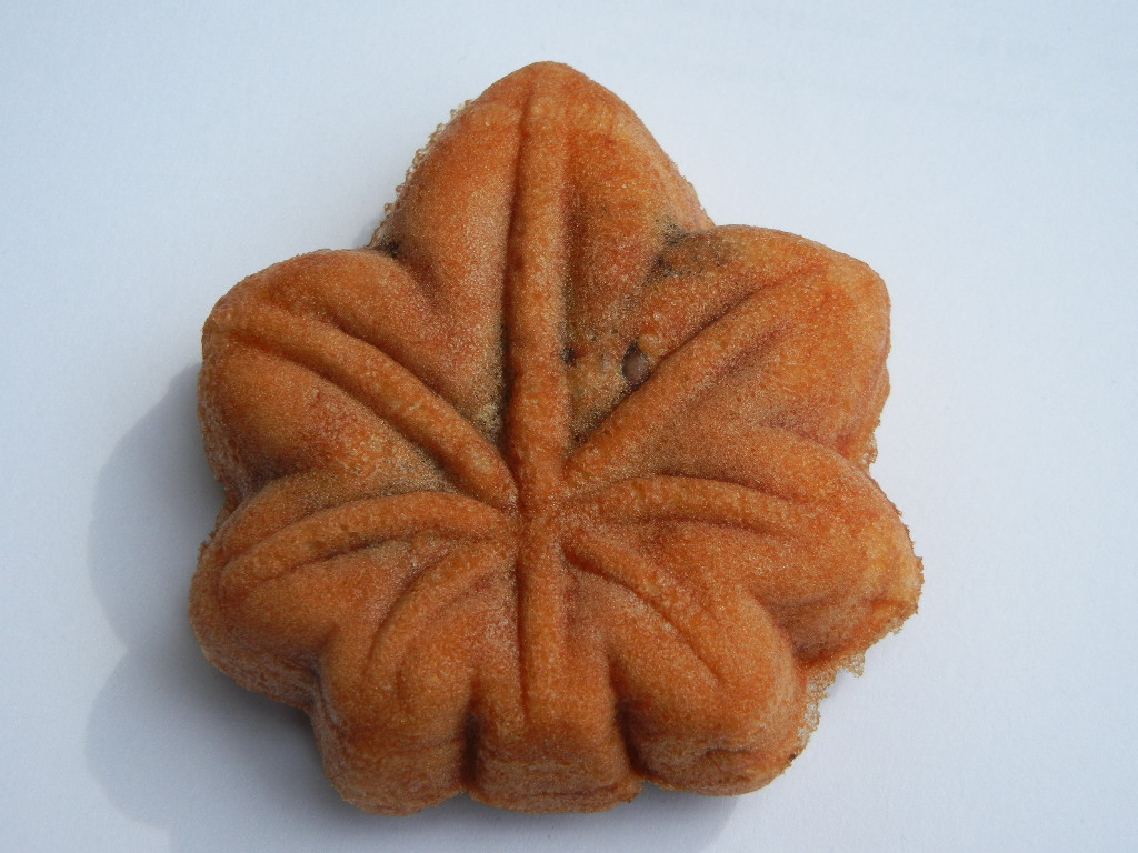 Various flavors of Momiji Manju, maple leaf-shaped cakes, a popular sweet souvenir from Miyajima Island.