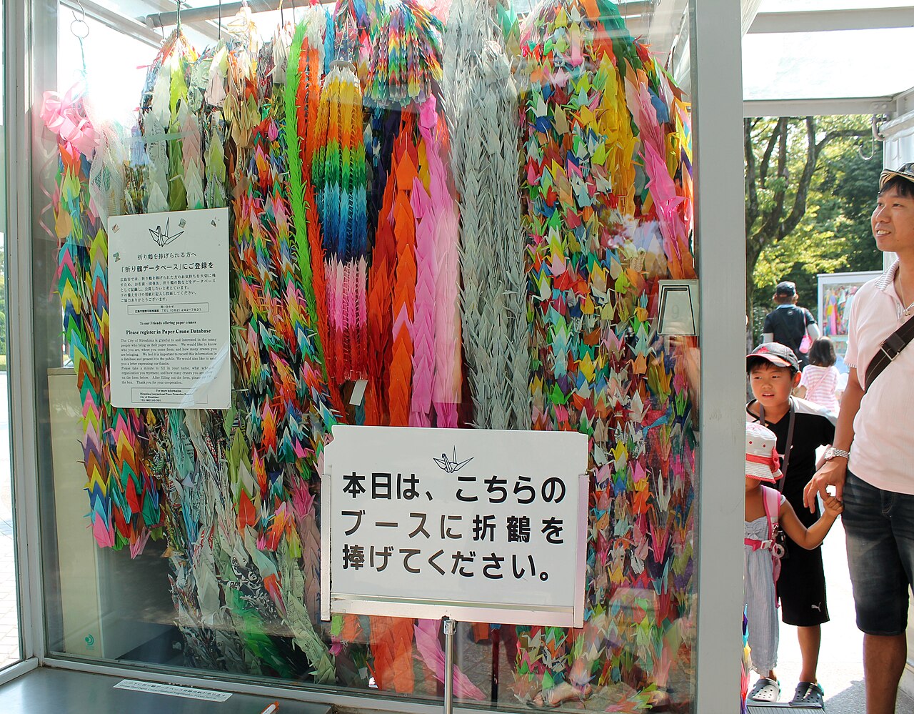 The Children's Peace Monument in Hiroshima Peace Memorial Park, adorned with paper cranes.