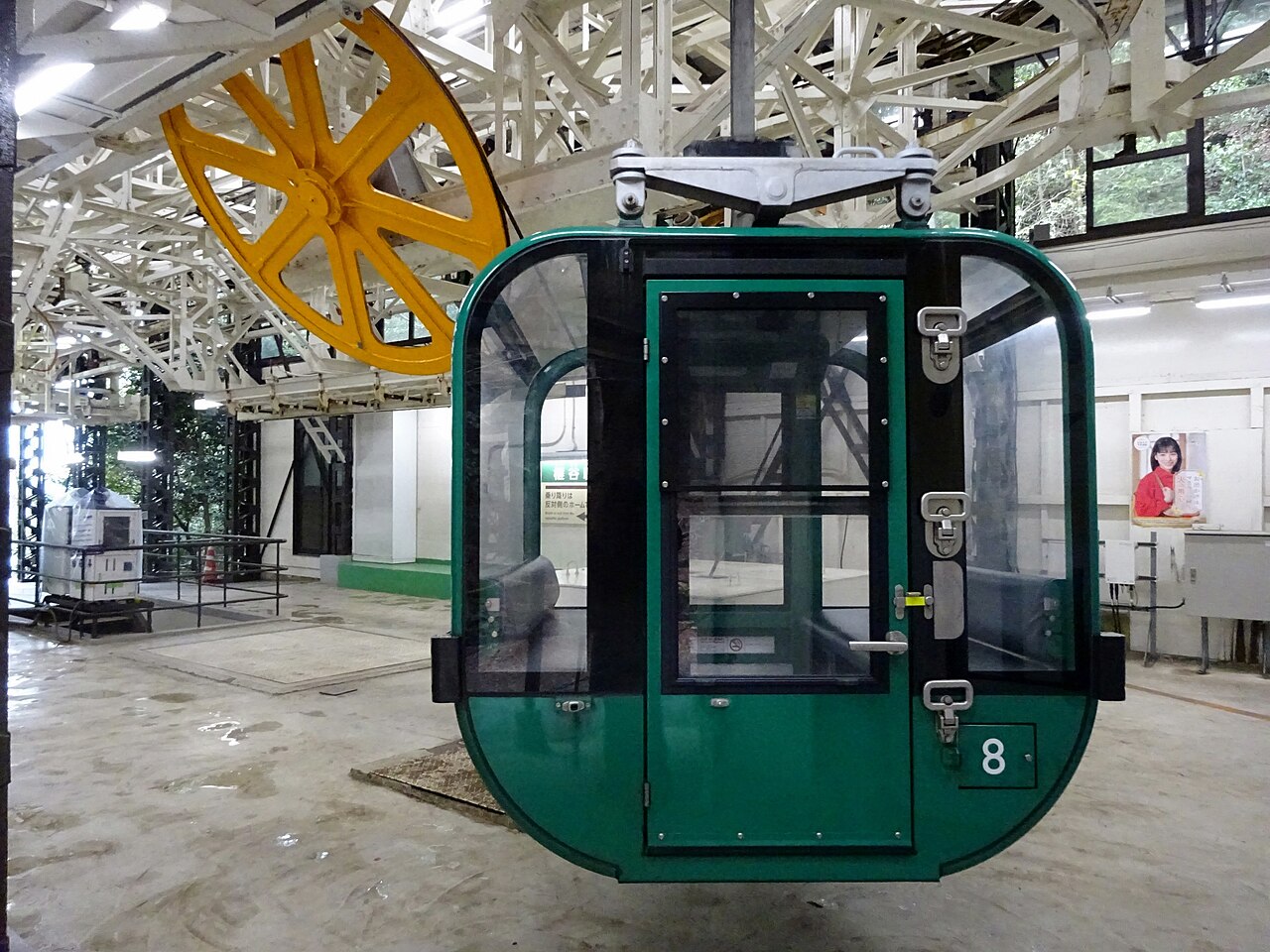 A gondola of the Miyajima Ropeway ascending Mt. Misen, offering scenic views of the island and sea.