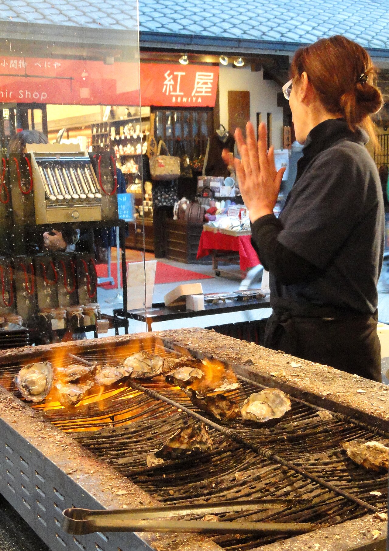 Freshly grilled oysters, a popular local delicacy served on Miyajima's shopping street.