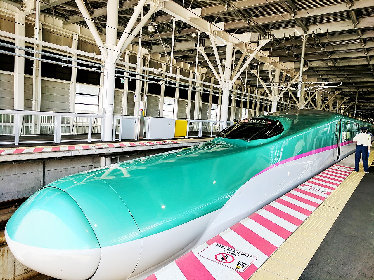 The Hokkaido Shinkansen Hayabusa train with its distinctive green stripe livery.