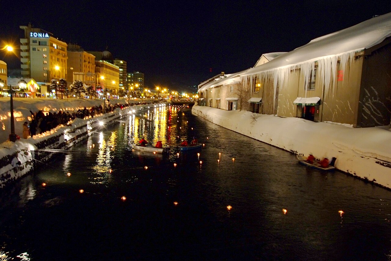 Candle-lit snow lanterns along the Otaru Canal during the Snow Light Path festival