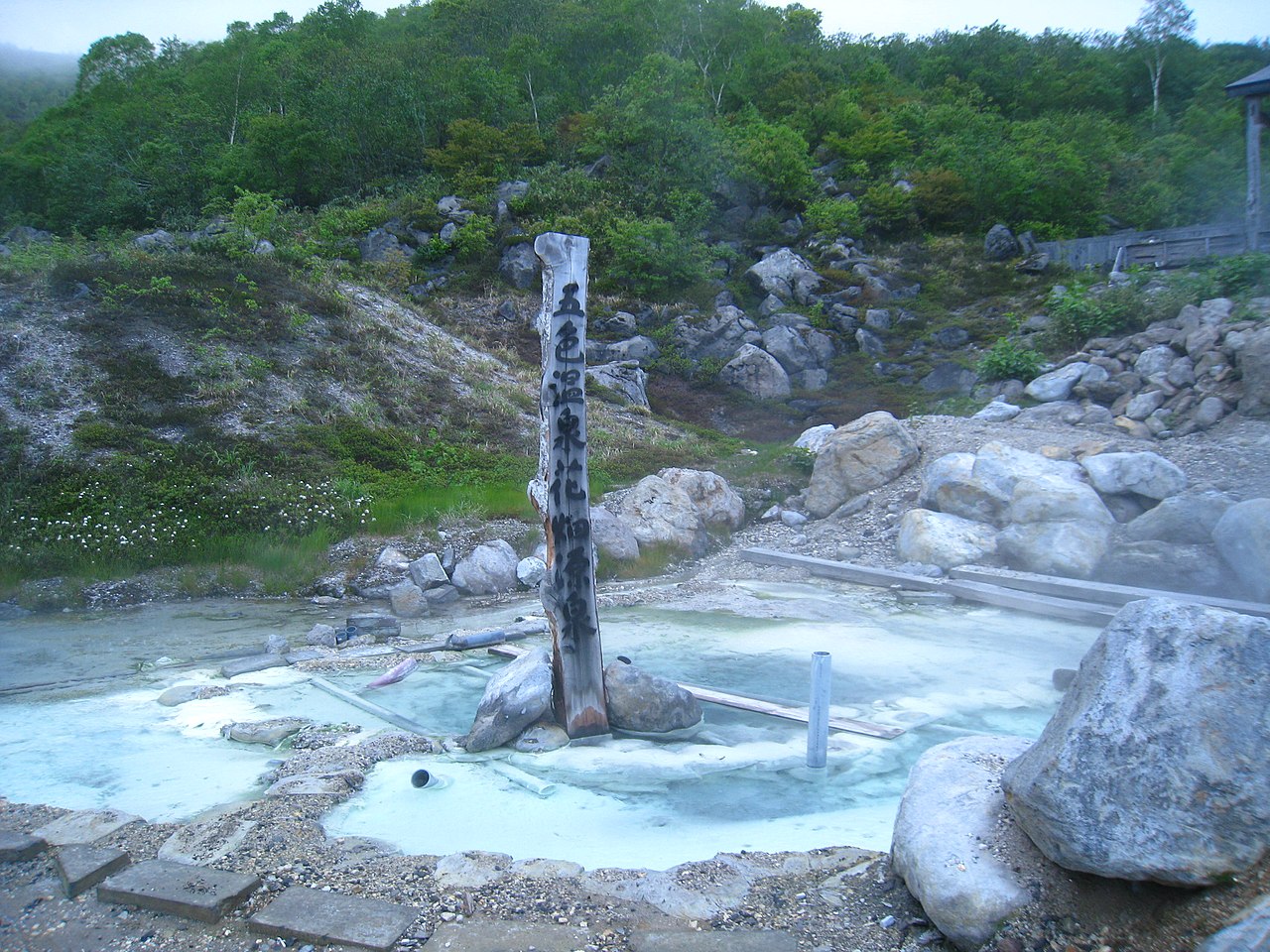 Relaxing in an outdoor onsen bath surrounded by snow in Niseko