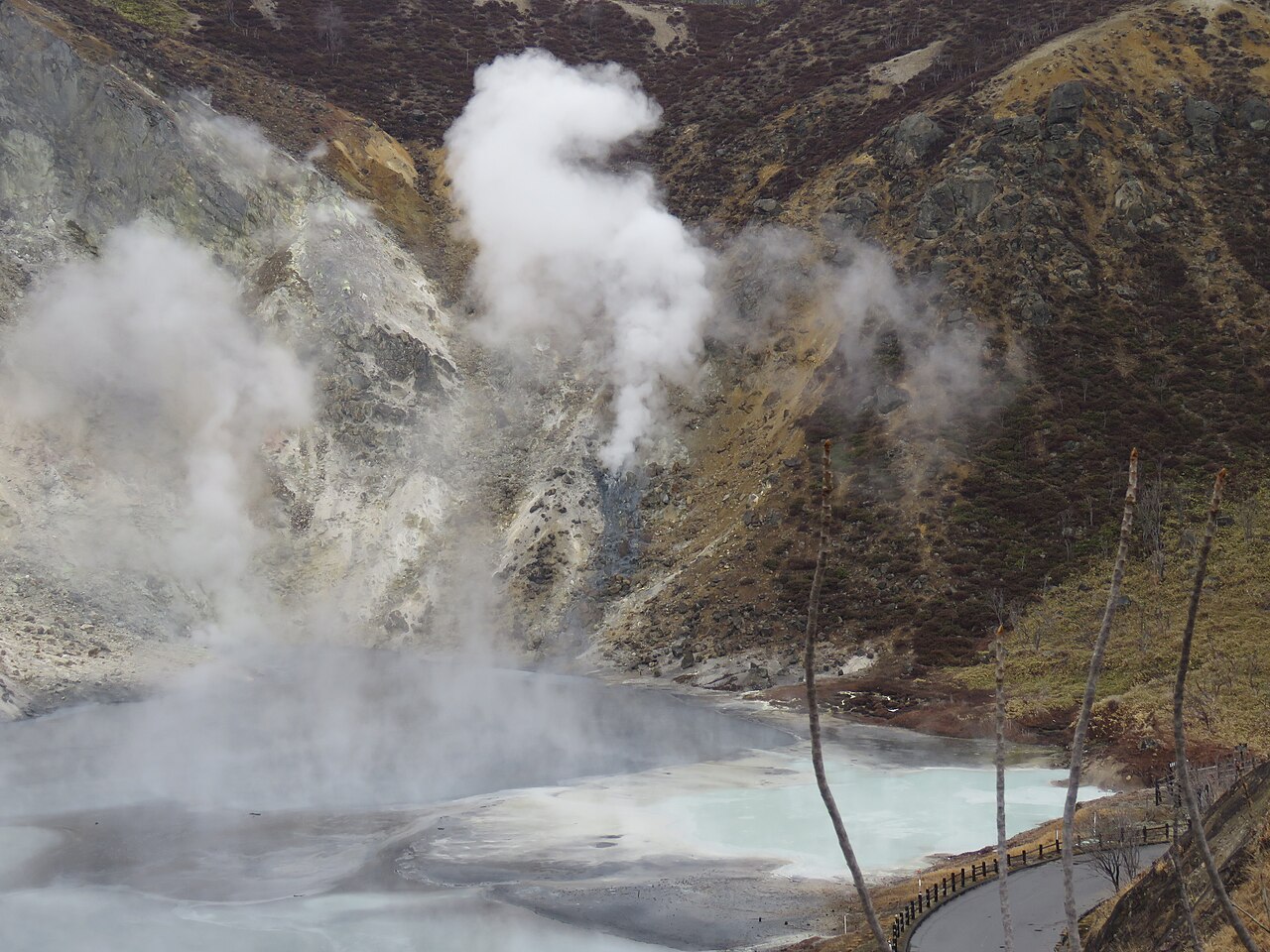 Oyunuma Pond, a natural hot spring lake with steam rising in Noboribetsu