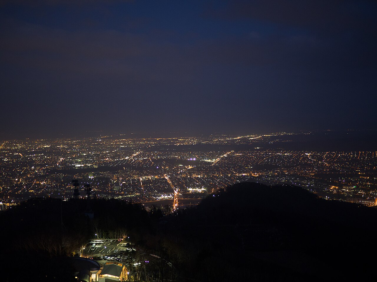 Breathtaking panoramic night view of Sapporo city from the Mt. Moiwa observation deck