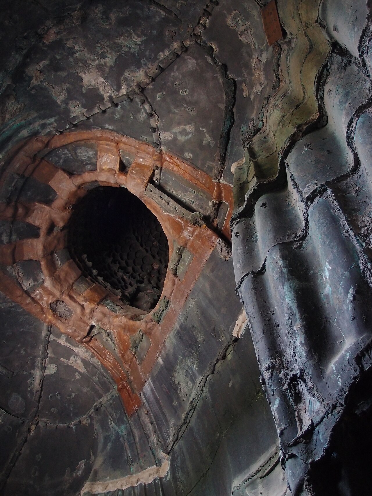 Interior view of the Kamakura Great Buddha, showing its hollow structure and casting marks.