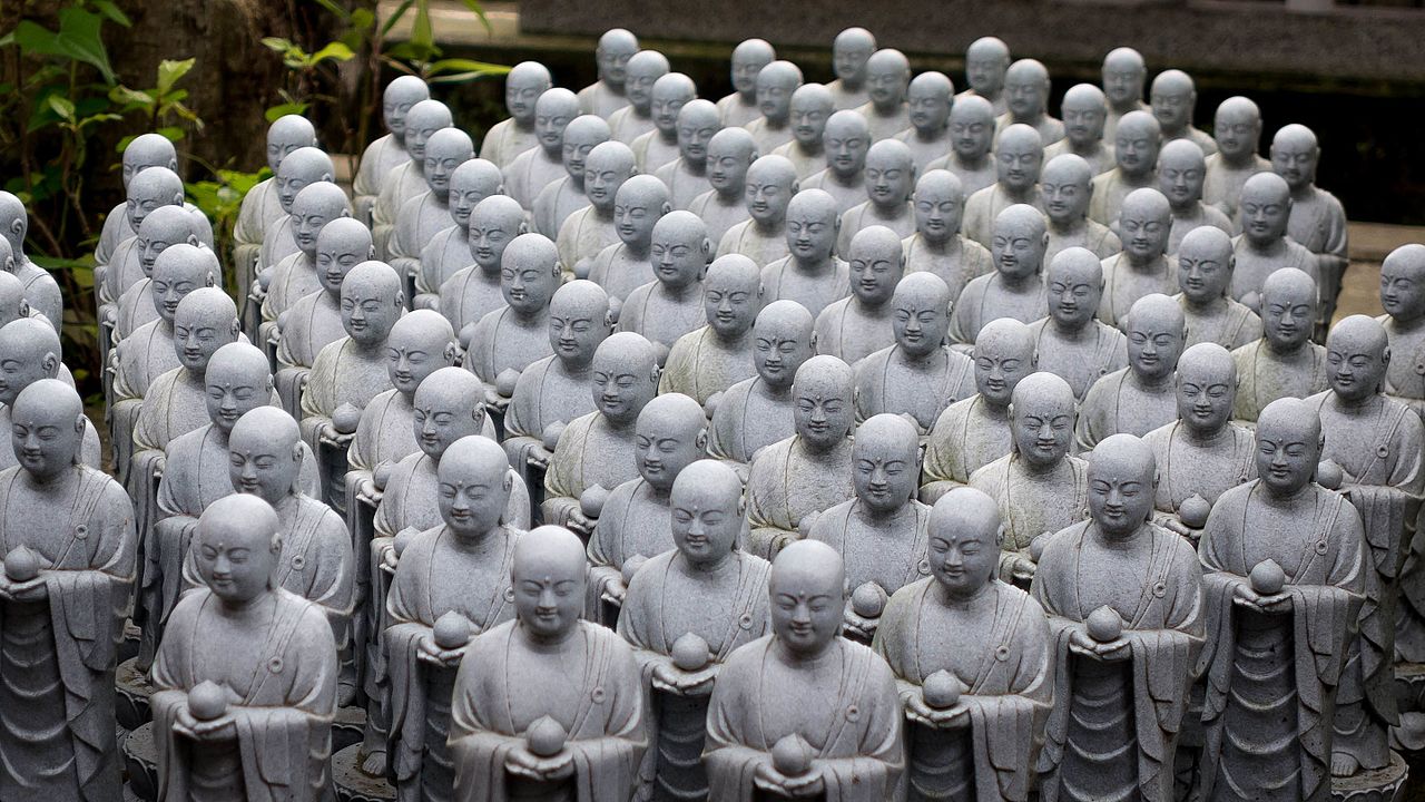 Thousands of small Jizo statues lining the hillside at Hase-dera Temple