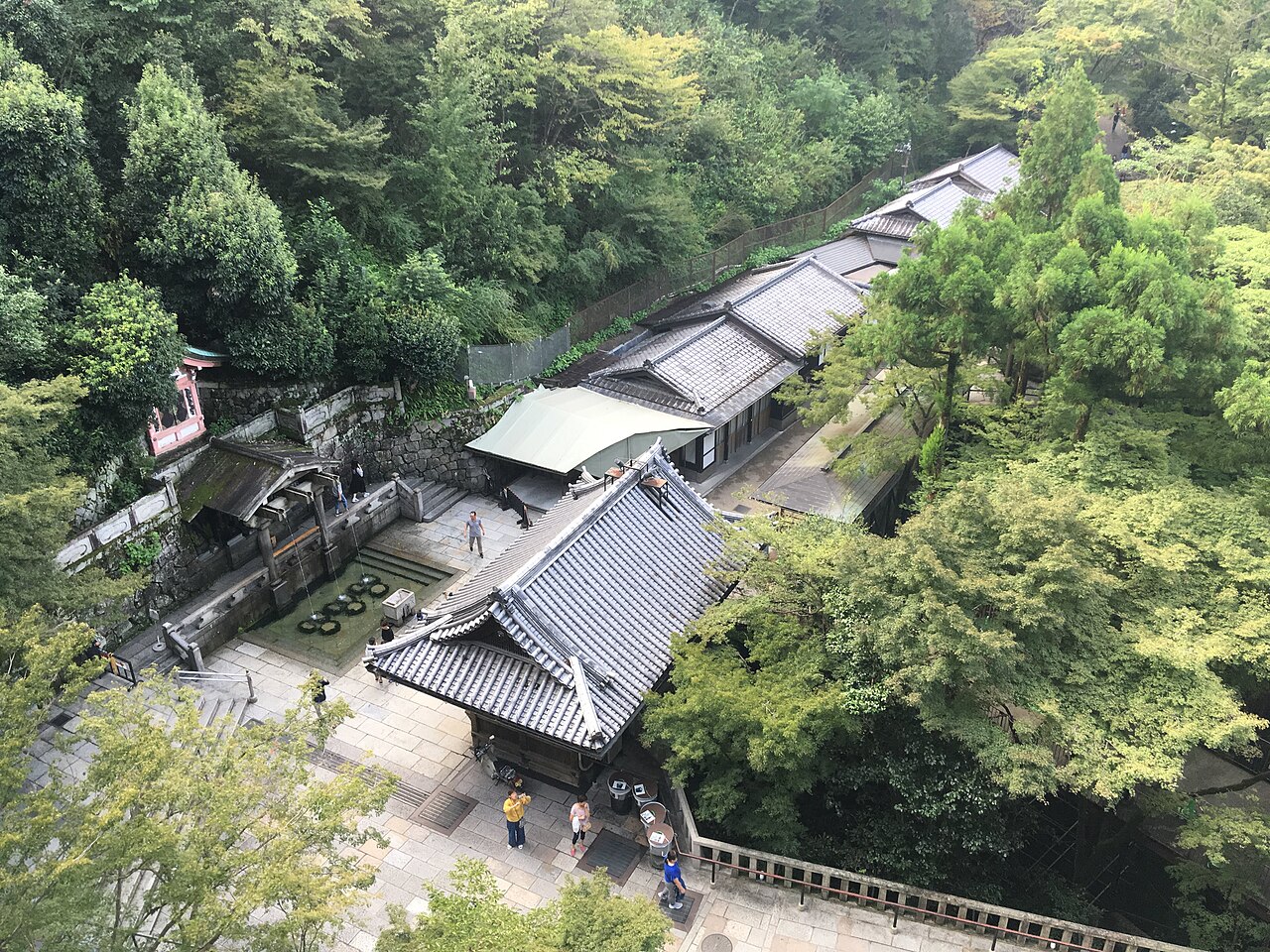 The three streams of Otowa Waterfall at Kiyomizu-dera, with visitors collecting water