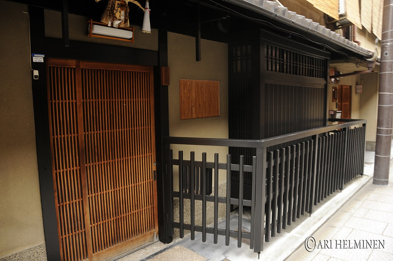 Traditional wooden machiya houses lining Hanami-koji street in Kyoto's Gion district