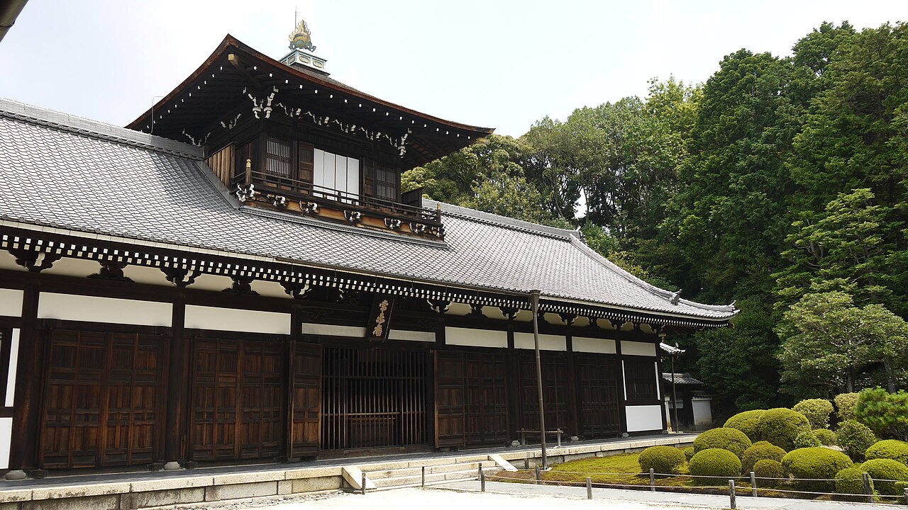 Tsutenkyo Bridge at Tofuku-ji Temple surrounded by vibrant red autumn maple leaves