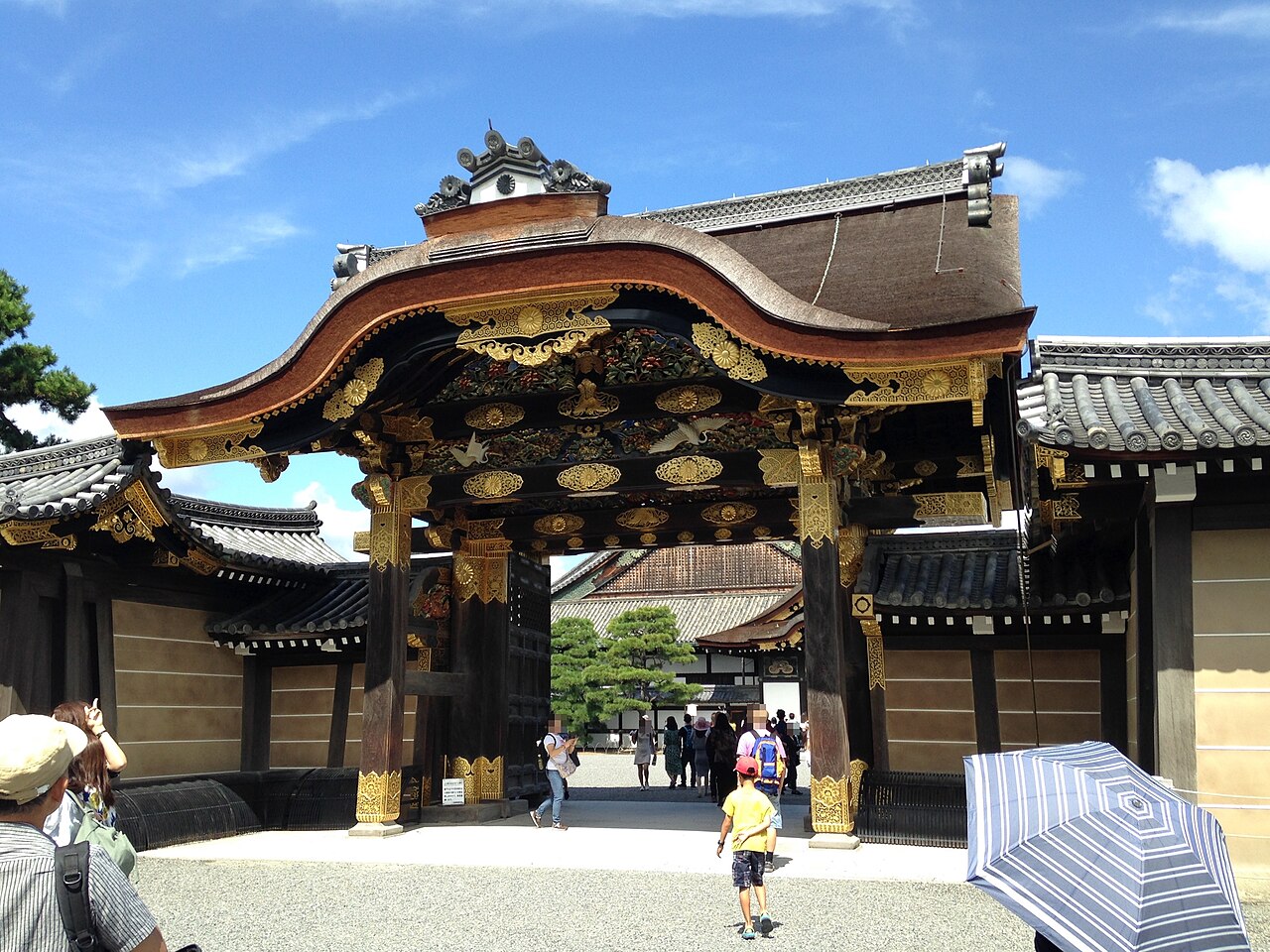 Ornate Karamon Gate, the main entrance to Nijo Castle, with intricate carvings and gold leaf details