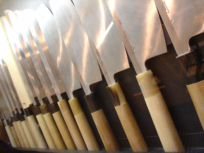 Display of finely crafted Japanese kitchen knives at a shop in Nishiki Market