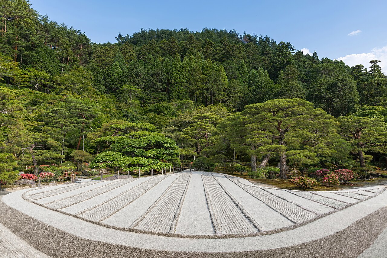 The iconic dry sand garden of Ginkaku-ji, featuring a large cone-shaped sand mound and meticulously raked patterns.