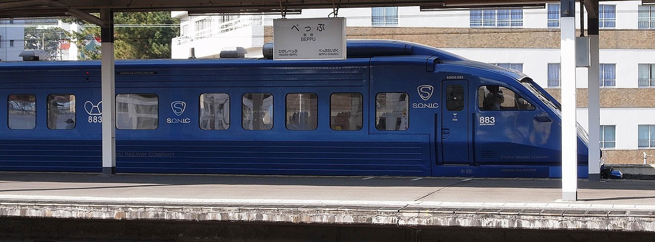 The blue metallic exterior of the JR Kyushu Limited Express Sonic 883 series train.