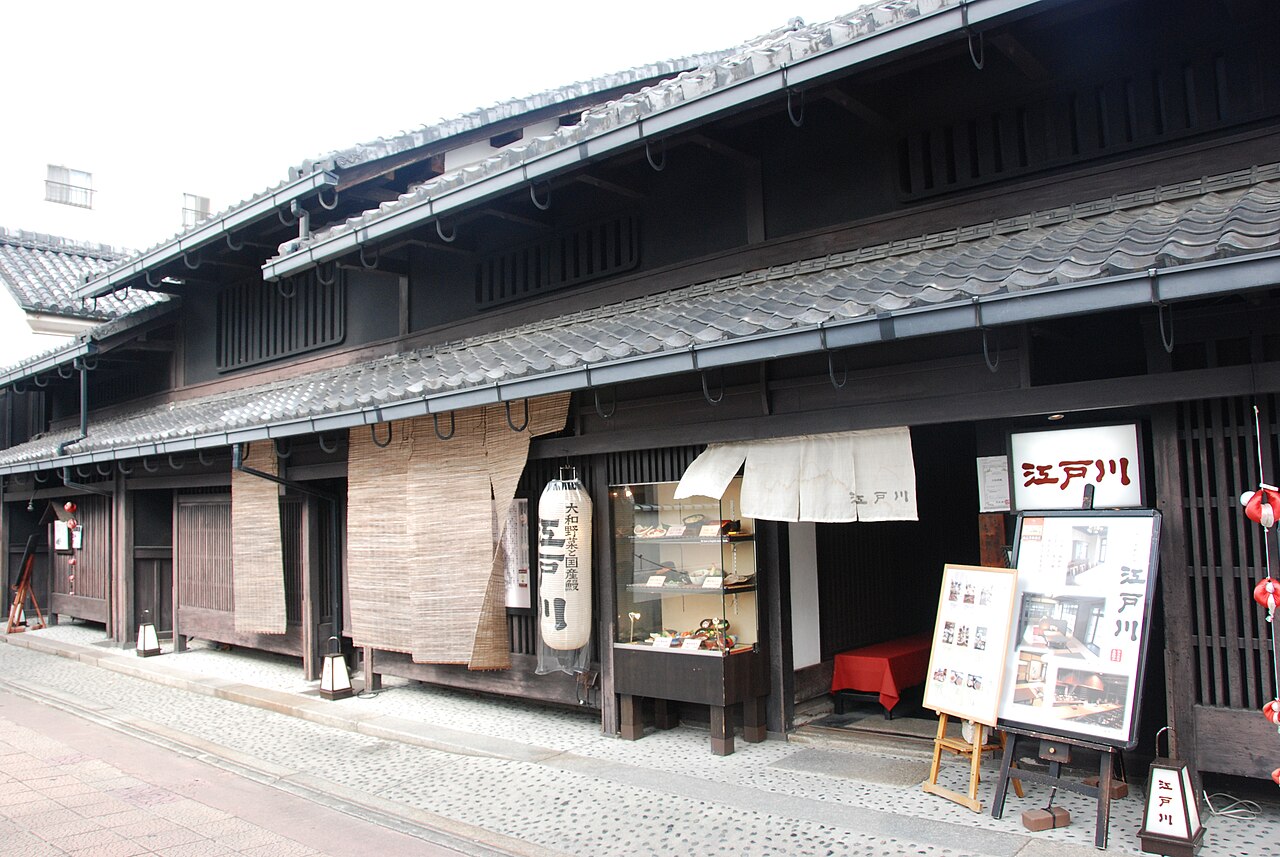 Traditional machiya merchant houses with wooden facades in the historic Naramachi district