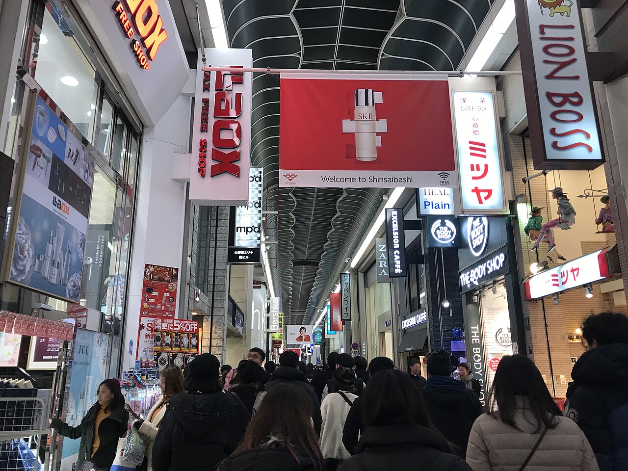 Shoppers walking through the covered Shinsaibashi-suji shopping arcade in Namba