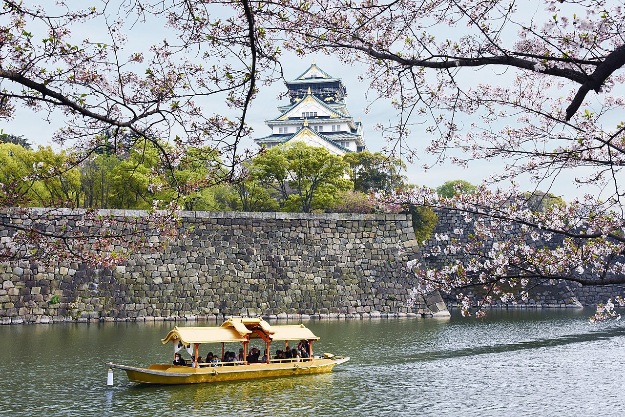 Gold boat cruising on the moat around Osaka Castle