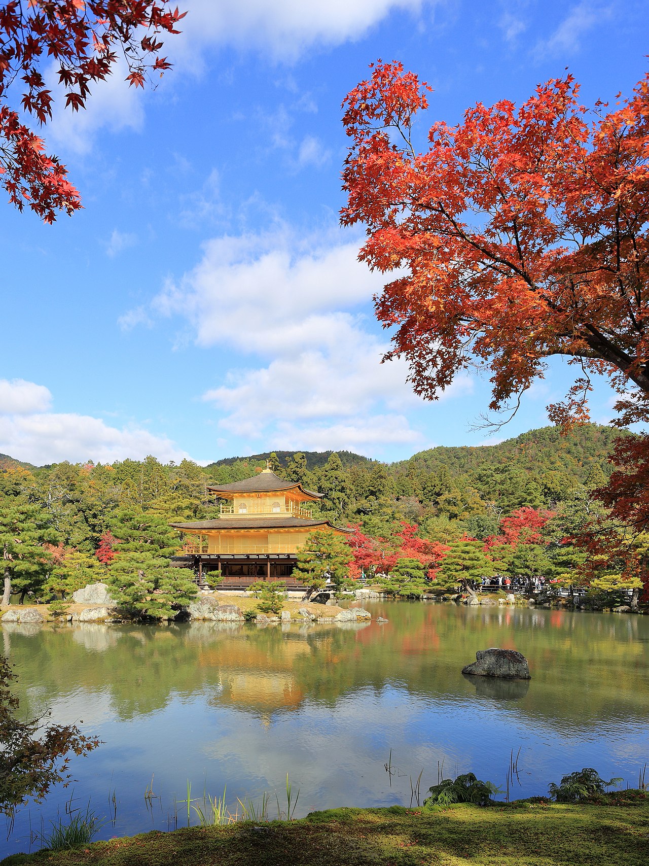 The Golden Pavilion (Kinkaku-ji) reflecting beautifully in the pond with surrounding autumn foliage