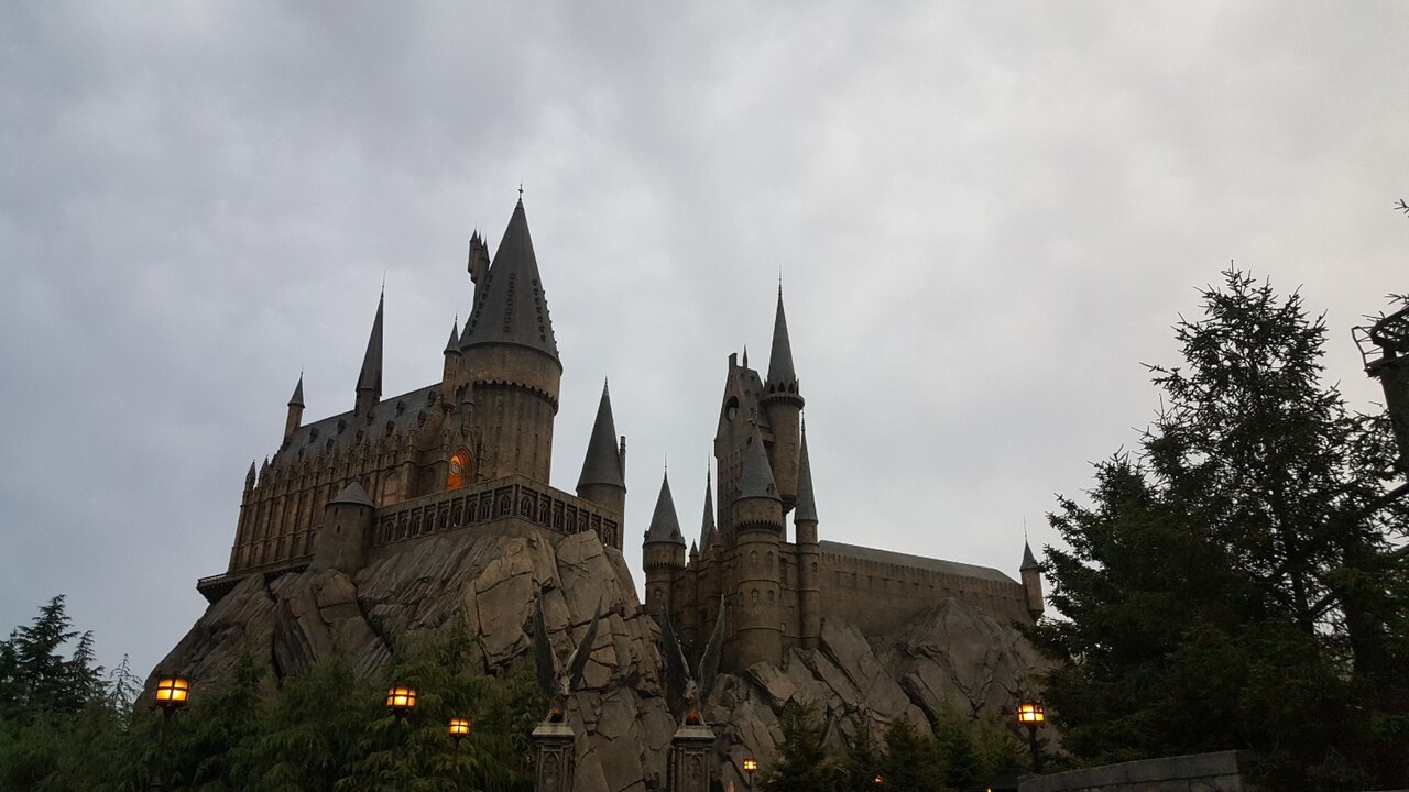 Hogwarts Castle towering over Hogsmeade village at Universal Studios Japan