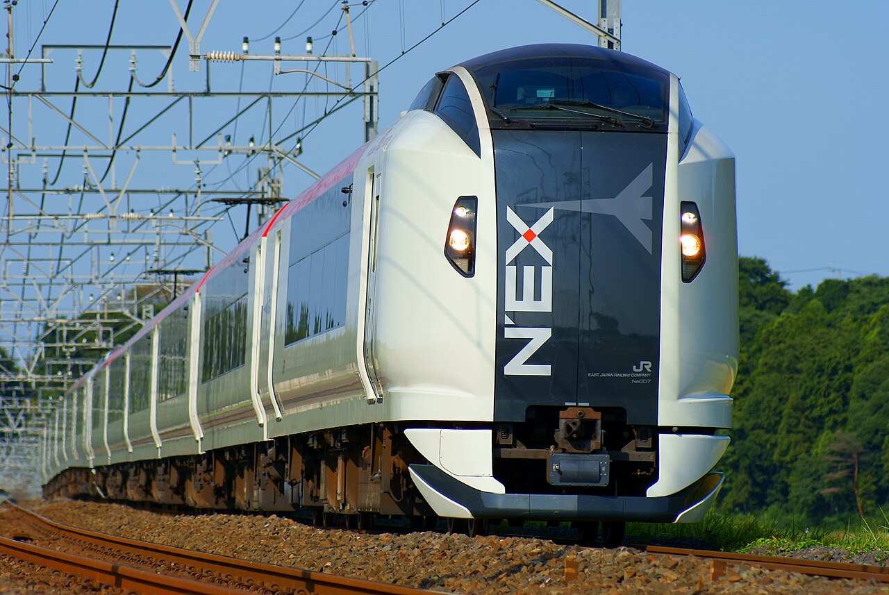 A red and white Narita Express (N'EX) train at Narita Airport.