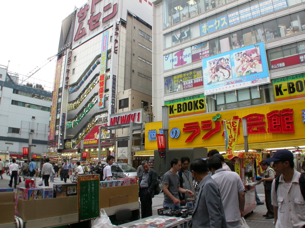 Interior view of a multi-story electronics store in Akihabara, showcasing various gadgets and appliances