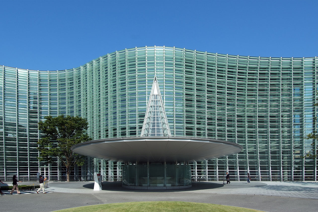 Exterior view of the unique glass facade of The National Art Center, Tokyo