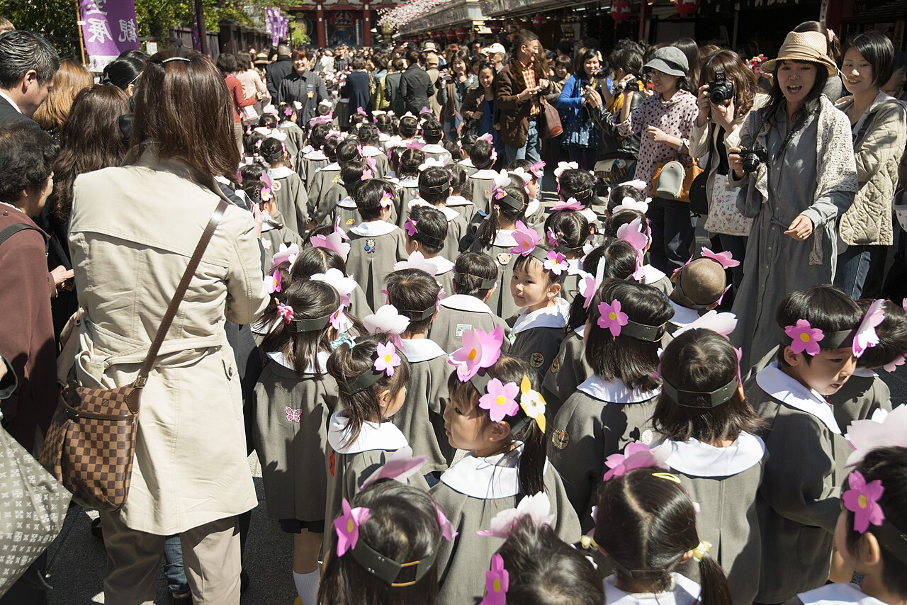 Vibrant Nakamise-dori street in Asakusa lined with traditional shops, leading towards Senso-ji Temple