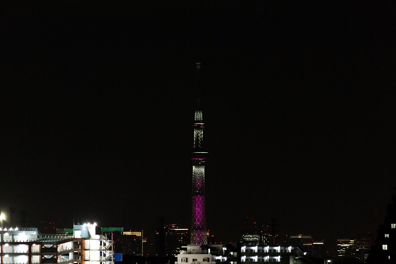Tokyo Skytree illuminated at night against a dark sky