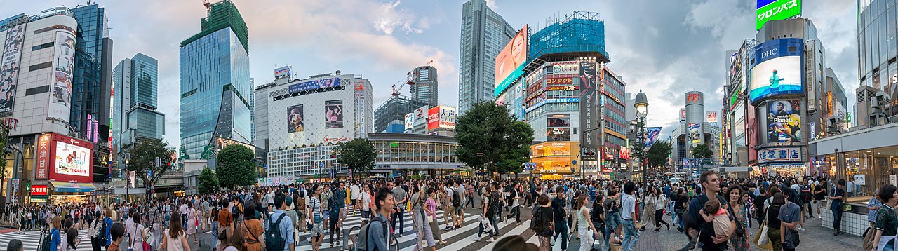 Pedestrians walking on a busy street in Tokyo
